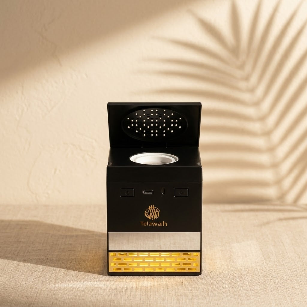 Electric bakhoor burner with open lid and golden glow